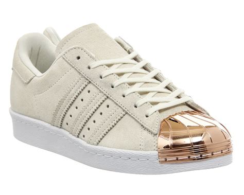 adidas rose gold superstar trainers.